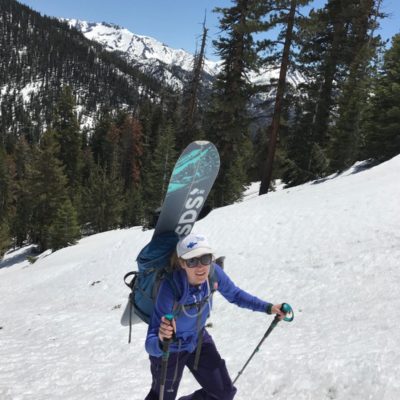 Megan Fiske with snowboard - One of the adventure guides at Wild Yosemite Adventure Guide Services